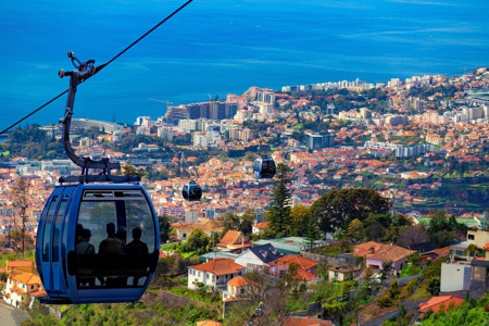 1627561361-aerial-view-of-funchal-with-traditional-cable-car-above-the-city-in-madeira-island-portugal-image-1.jpg